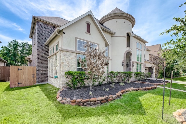 3650 Sage Hollow Dr, Spring, TX 77386 - view of front facade featuring stucco siding and a gate