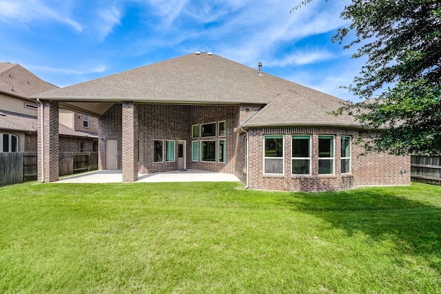 3650 Sage Hollow Dr, Spring, TX 77386 - back of property with a patio, brick siding, and a shingled roof