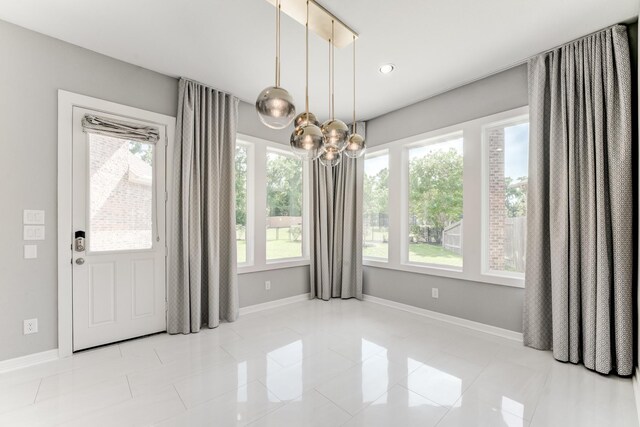 3650 Sage Hollow Dr, Spring, TX 77386 - unfurnished dining area featuring a chandelier, baseboards, tile patterned flooring, and recessed lighting