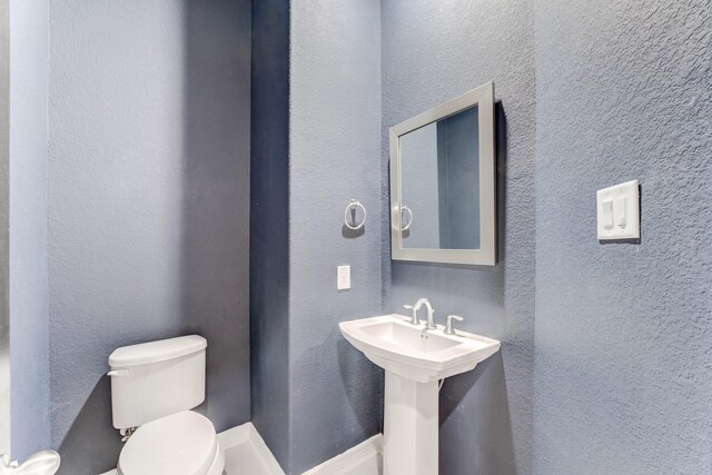 3650 Sage Hollow Dr, Spring, TX 77386 - bathroom featuring toilet and a sink