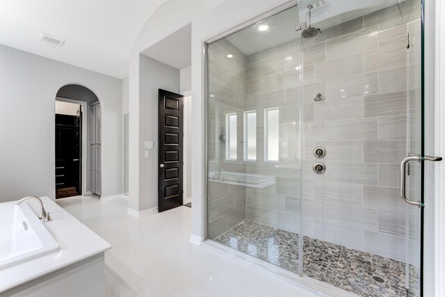 3650 Sage Hollow Dr, Spring, TX 77386 - full bathroom featuring a stall shower, tile patterned floors, baseboards, and a sink