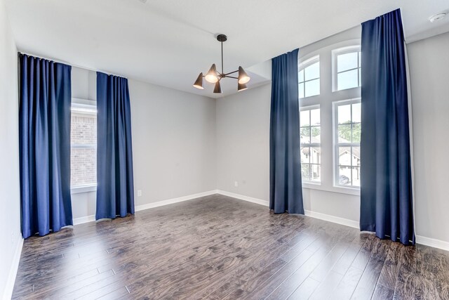 3650 Sage Hollow Dr, Spring, TX 77386 - spare room with plenty of natural light, a chandelier, wood finished floors, and baseboards