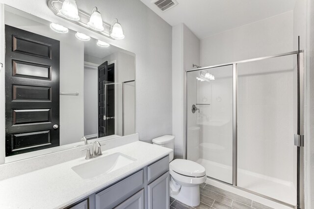3650 Sage Hollow Dr, Spring, TX 77386 - bathroom featuring vanity, a shower stall, and toilet