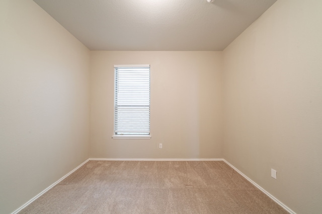 16414 Peyton Stone Cir, Houston, TX 77049 - empty room with light carpet and baseboards