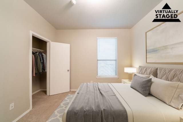 16414 Peyton Stone Cir, Houston, TX 77049 - bedroom featuring light colored carpet, baseboards, a spacious closet, and a closet