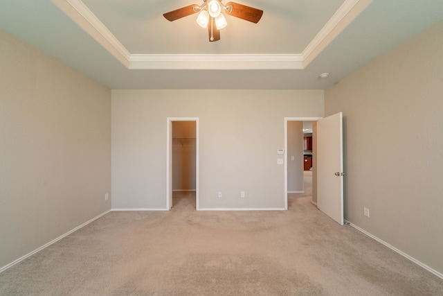 16414 Peyton Stone Cir, Houston, TX 77049 - unfurnished bedroom with a raised ceiling, crown molding, light carpet, a spacious closet, and ceiling fan