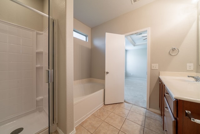 16414 Peyton Stone Cir, Houston, TX 77049 - bathroom with a shower stall, vanity, a garden tub, tile patterned floors, and baseboards