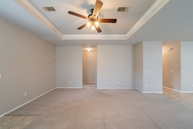 16414 Peyton Stone Cir, Houston, TX 77049 - spare room with a raised ceiling, ceiling fan, light carpet, crown molding, and baseboards