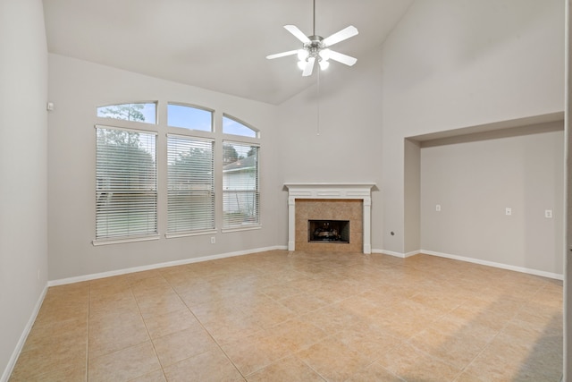17426 Memorial Blossom Dr, Spring, TX 77379 - unfurnished living room with a ceiling fan, a fireplace, light tile patterned floors, high vaulted ceiling, and baseboards