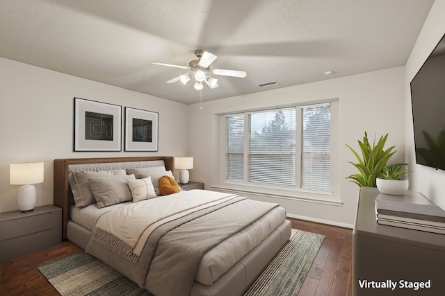 17426 Memorial Blossom Dr, Spring, TX 77379 - bedroom with dark wood-style flooring, baseboards, and a ceiling fan