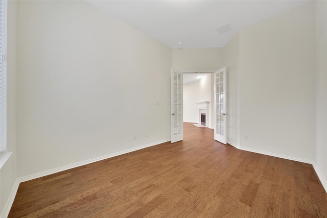 10938 Glenrothers Dr, Richmond, TX 77407 - unfurnished room with french doors and wood finished floors