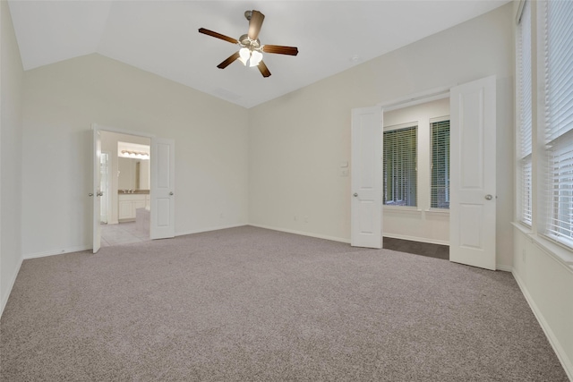 10938 Glenrothers Dr, Richmond, TX 77407 - unfurnished bedroom with vaulted ceiling, carpet, ceiling fan, and connected bathroom