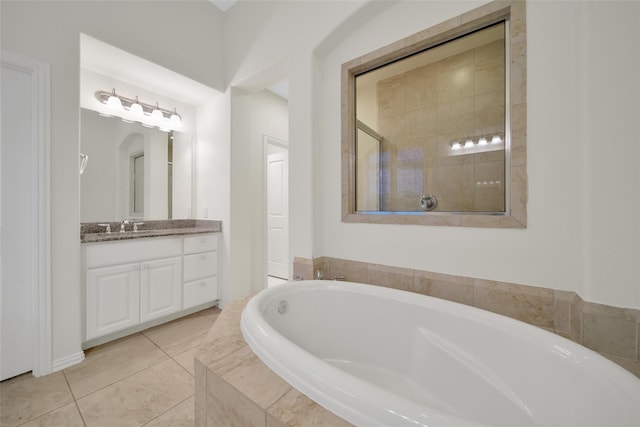 10938 Glenrothers Dr, Richmond, TX 77407 - full bath with a garden tub, vanity, tile patterned floors, and tiled shower