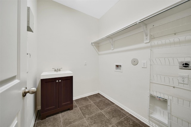 10938 Glenrothers Dr, Richmond, TX 77407 - laundry room with hookup for a washing machine and dark tile patterned floors