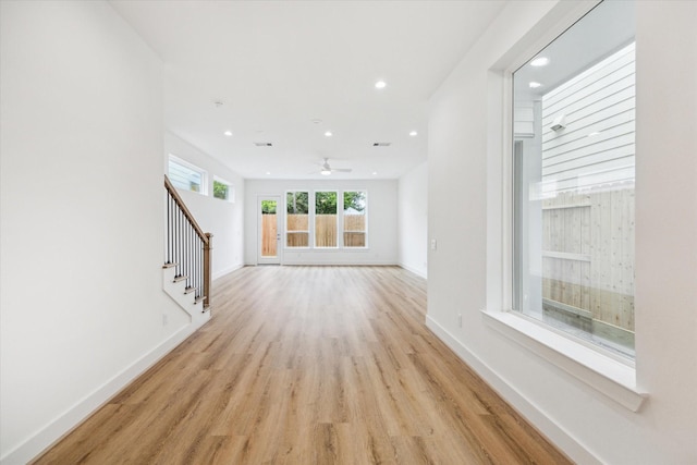 1212 Nadine St, Houston, TX 77009 - unfurnished living room featuring stairs, recessed lighting, light wood-style floors, baseboards, and a ceiling fan
