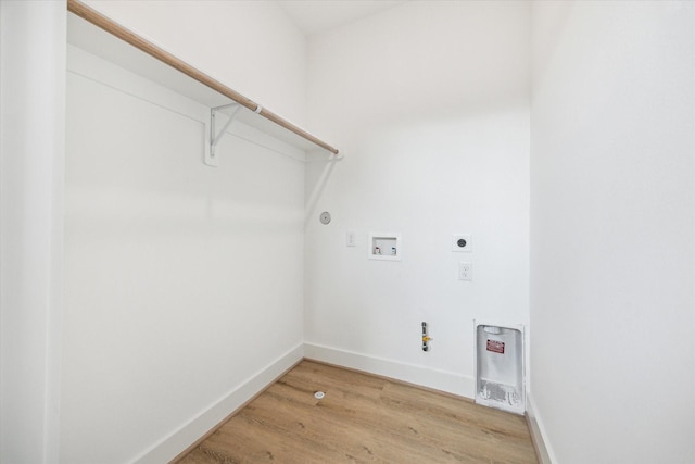 1212 Nadine St, Houston, TX 77009 - laundry area featuring gas dryer hookup, light wood-type flooring, hookup for a washing machine, electric dryer hookup, and baseboards