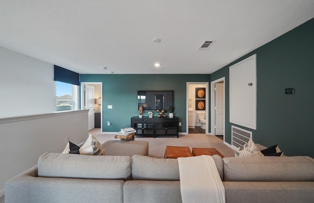 25319 Merino Dr, Magnolia, TX 77355 - living room featuring baseboards and light carpet