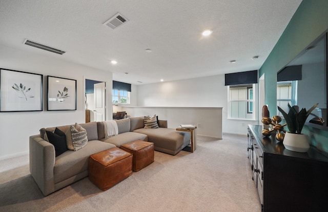 25319 Merino Dr, Magnolia, TX 77355 - living room featuring light colored carpet, recessed lighting, baseboards, and a textured ceiling