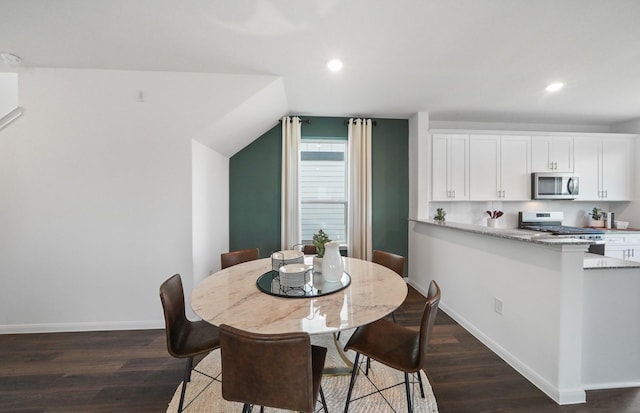 25319 Merino Dr, Magnolia, TX 77355 - dining room with dark wood-type flooring, recessed lighting, baseboards, and vaulted ceiling