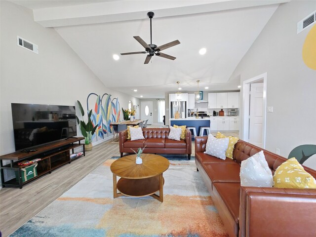 11810 Sagedowne Ln, Houston, TX 77089 - living room with light wood-style flooring, high vaulted ceiling, a ceiling fan, baseboards, and beam ceiling