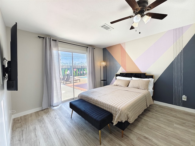 11810 Sagedowne Ln, Houston, TX 77089 - bedroom featuring access to exterior, light wood finished floors, baseboards, and a ceiling fan
