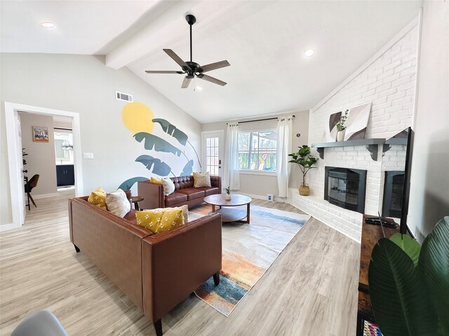 11810 Sagedowne Ln, Houston, TX 77089 - living area featuring light wood-style flooring, ceiling fan, a brick fireplace, and baseboards