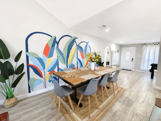 11810 Sagedowne Ln, Houston, TX 77089 - dining area with arched walkways, light wood-style flooring, baseboards, and recessed lighting