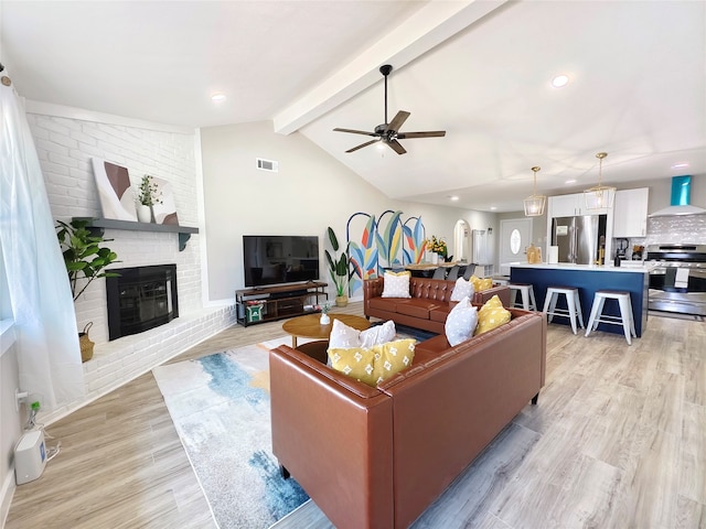 11810 Sagedowne Ln, Houston, TX 77089 - living area featuring light wood-type flooring, a ceiling fan, a brick fireplace, baseboards, and recessed lighting