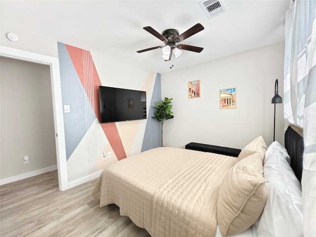 11810 Sagedowne Ln, Houston, TX 77089 - bedroom with light wood-style flooring, baseboards, and ceiling fan