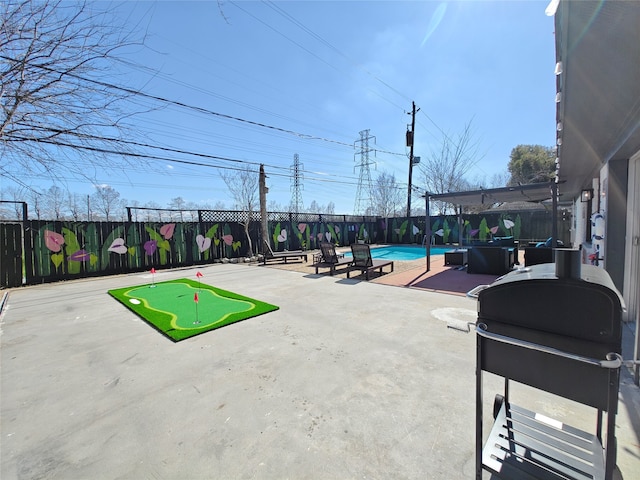 11810 Sagedowne Ln, Houston, TX 77089 - fenced backyard featuring an area to practice putting, a patio, and grilling area