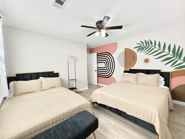 11810 Sagedowne Ln, Houston, TX 77089 - bedroom with light wood-style flooring, baseboards, and a ceiling fan