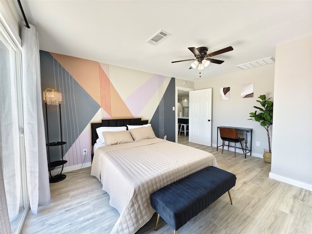 11810 Sagedowne Ln, Houston, TX 77089 - bedroom with baseboards, light wood-style floors, and a ceiling fan