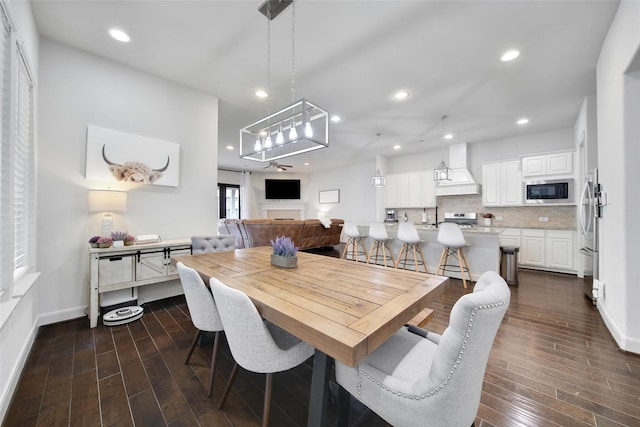 118 Grant Cove Dr, Montgomery, TX 77316 - dining area featuring dark wood-style floors, baseboards, and recessed lighting