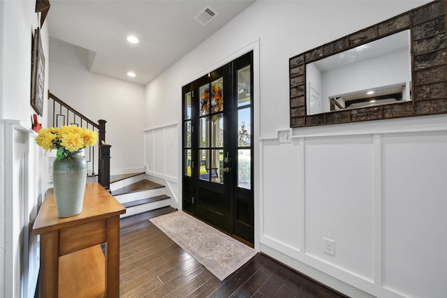 118 Grant Cove Dr, Montgomery, TX 77316 - entrance foyer with stairs, a decorative wall, a wainscoted wall, dark wood-style floors, and recessed lighting