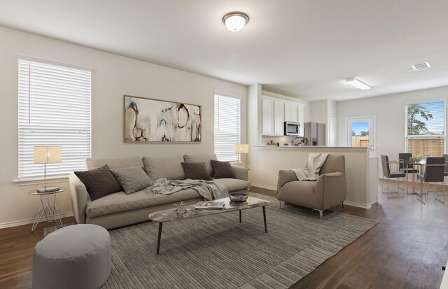 25323 Merino Dr, Magnolia, TX 77355 - living area featuring wood finished floors and baseboards