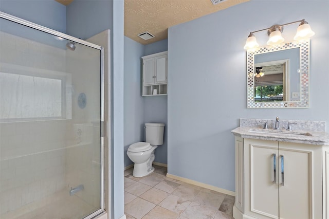 414 Enfield Dr, Highlands, TX 77562 - bathroom with vanity, toilet, a stall shower, baseboards, and a textured ceiling