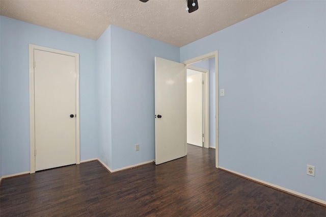 414 Enfield Dr, Highlands, TX 77562 - spare room with wood finished floors, ceiling fan, baseboards, and a textured ceiling