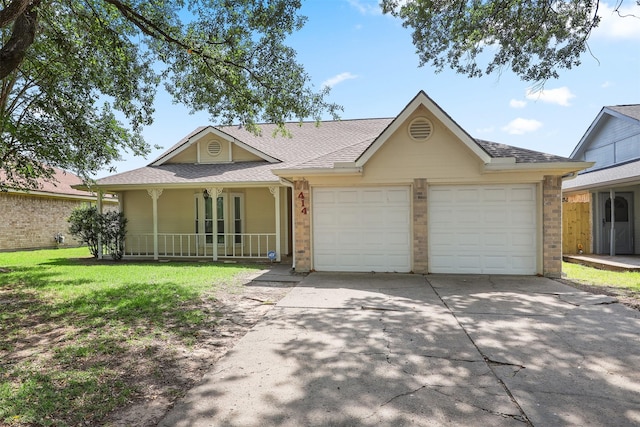 414 Enfield Dr, Highlands, TX 77562 - ranch-style home with a garage, a porch, driveway, and brick siding