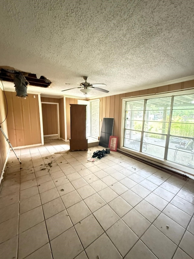 15125 S Dr, Channelview, TX 77530 - unfurnished living room with a textured ceiling, light tile patterned floors, and ceiling fan