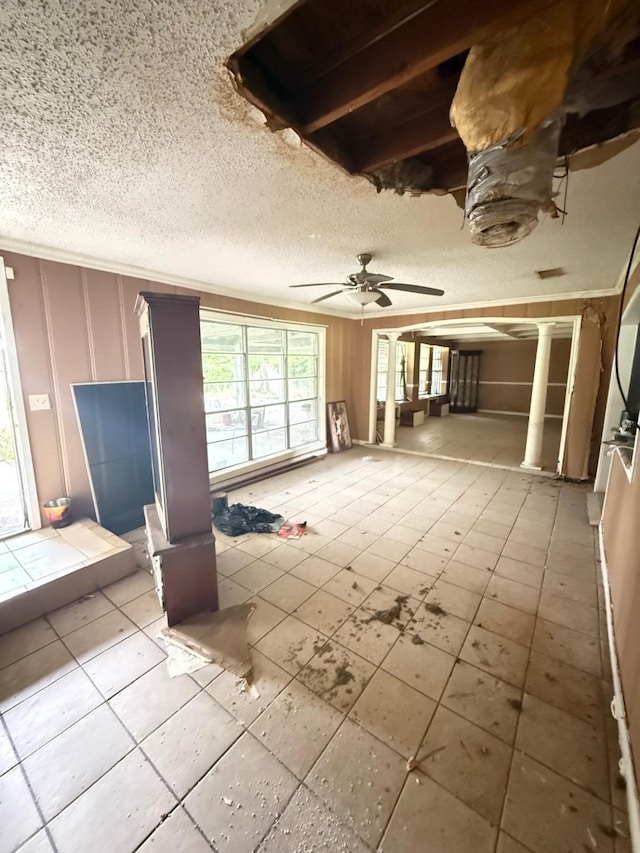 15125 S Dr, Channelview, TX 77530 - unfurnished living room with ceiling fan, a textured ceiling, and tile patterned flooring