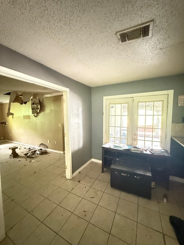 15125 S Dr, Channelview, TX 77530 - entryway with tile patterned floors, a textured ceiling, french doors, and baseboards