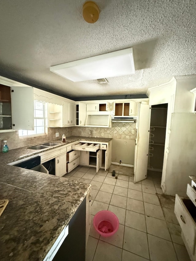 15125 S Dr, Channelview, TX 77530 - kitchen featuring open shelves, tasteful backsplash, a sink, a textured ceiling, and light tile patterned floors