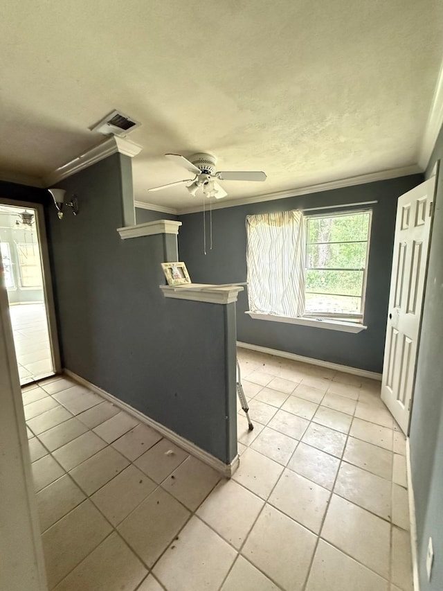 15125 S Dr, Channelview, TX 77530 - empty room featuring crown molding, light tile patterned floors, a ceiling fan, and baseboards