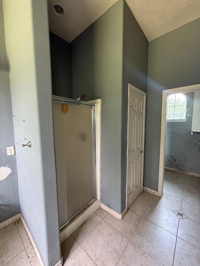15125 S Dr, Channelview, TX 77530 - bathroom featuring a stall shower, tile patterned floors, and baseboards
