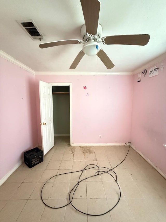 15125 S Dr, Channelview, TX 77530 - unfurnished bedroom with ornamental molding, light tile patterned floors, baseboards, a ceiling fan, and a closet