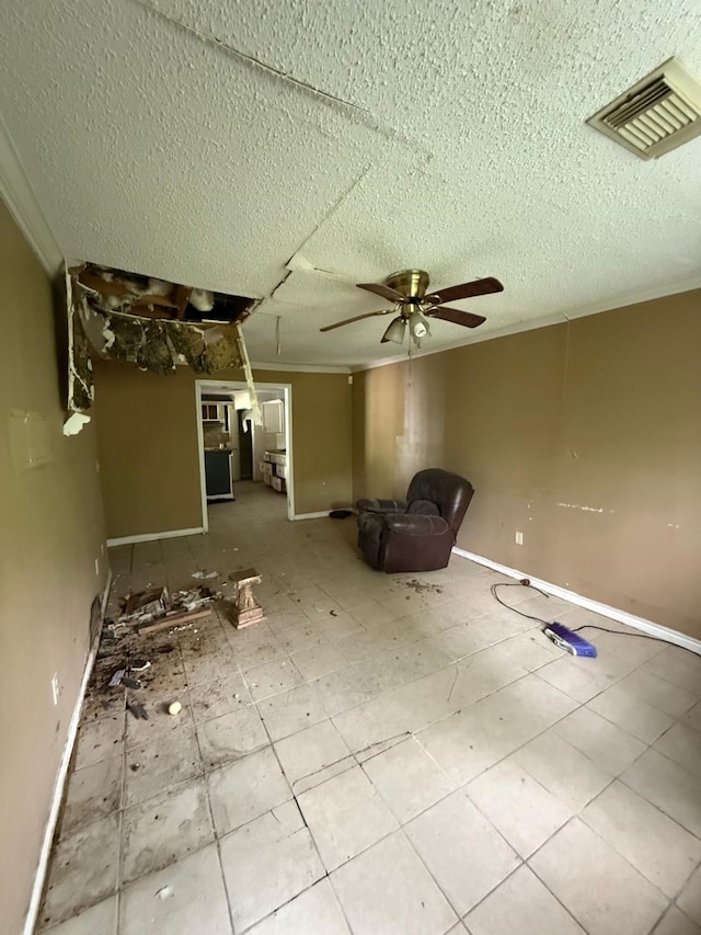 15125 S Dr, Channelview, TX 77530 - unfurnished room featuring a ceiling fan, baseboards, and a textured ceiling