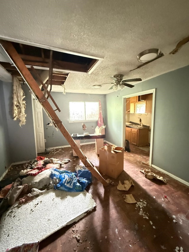 15125 S Dr, Channelview, TX 77530 - miscellaneous room with a textured ceiling, ceiling fan, and a sink