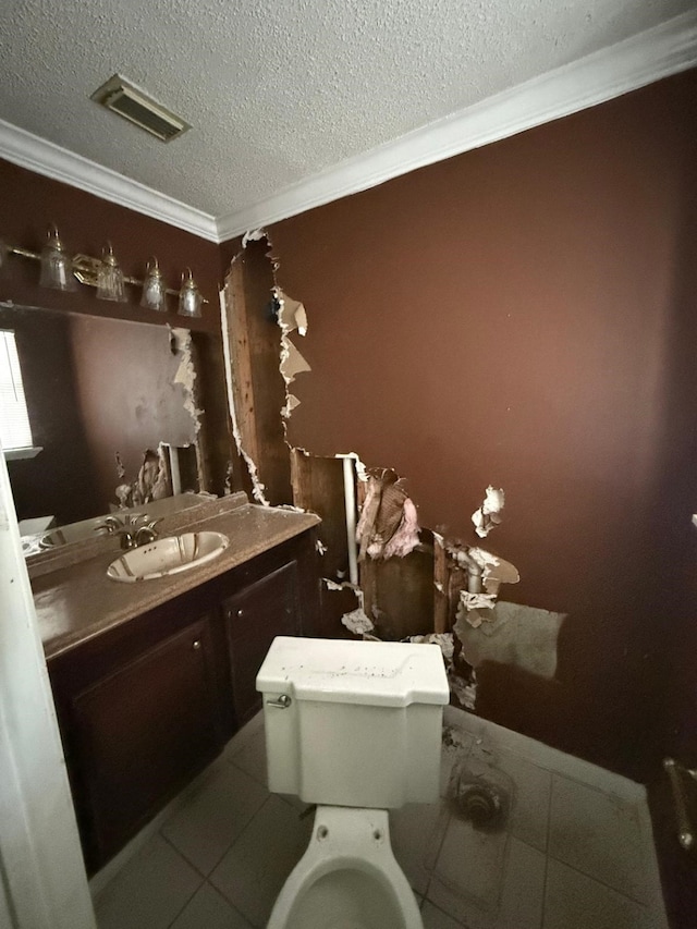 15125 S Dr, Channelview, TX 77530 - bathroom featuring crown molding, a textured ceiling, toilet, vanity, and tile patterned floors