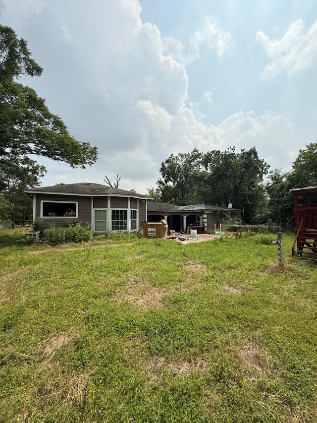 15125 S Dr, Channelview, TX 77530 - view of grassy yard featuring a patio area