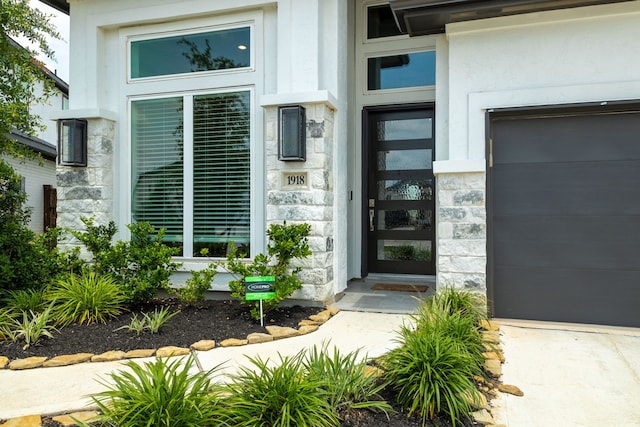 1918 Longcroft Ln, Katy, TX 77493 - property entrance featuring stone siding and an attached garage